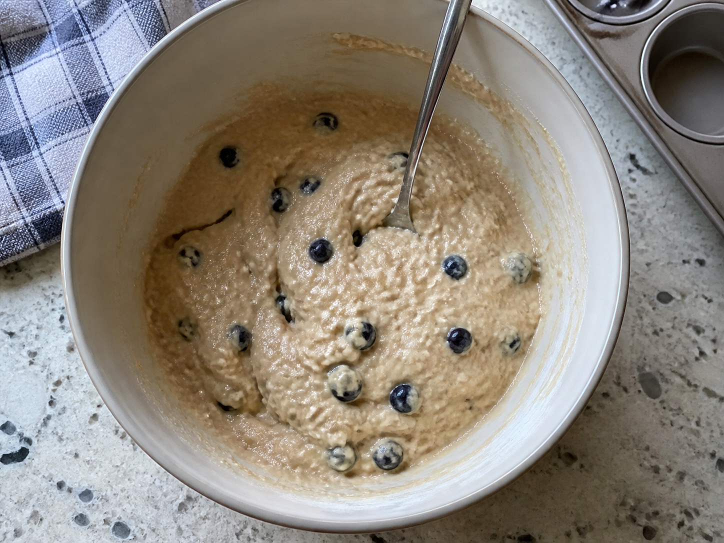 Rested thickened muffin batter in a mixing bowl