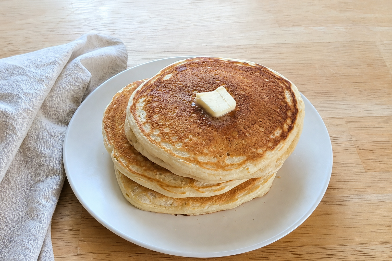 Fluffy pancake served on a plate in natural light