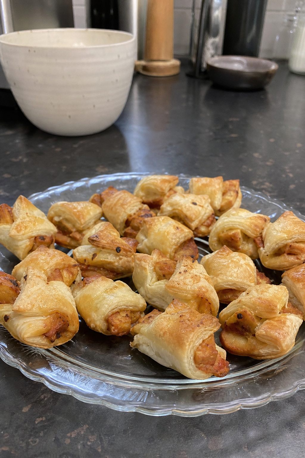 Small puff pastry bites with caramelized onion topping