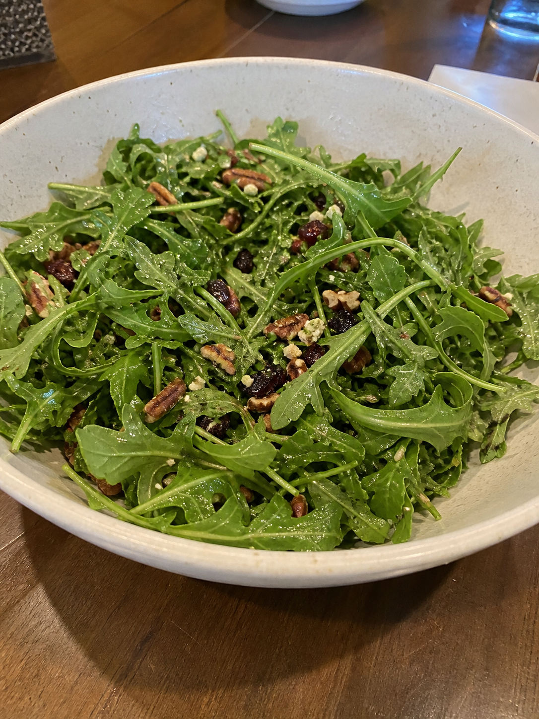 Casual bowl of arugula salad for pizza night