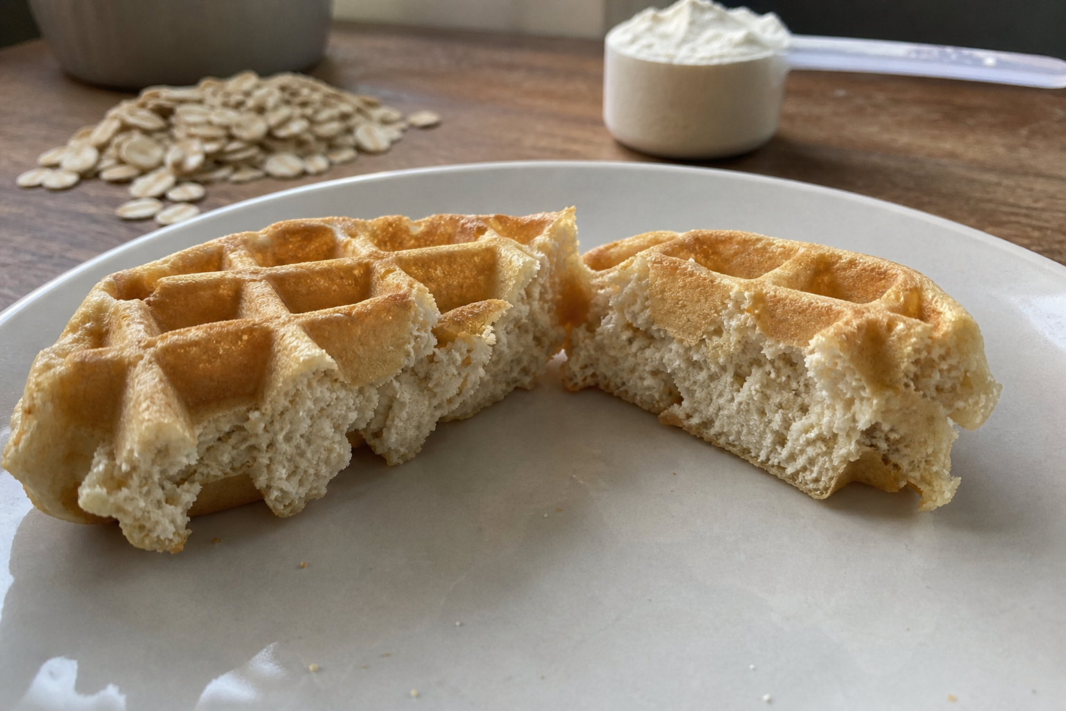 Dry protein waffles broken open to show a coarse crumb