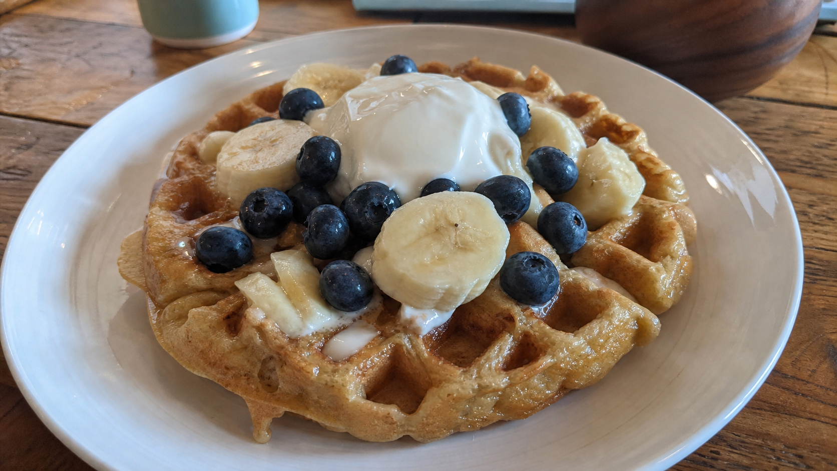 Protein waffles served with banana, blueberries and a moisture-rich topping