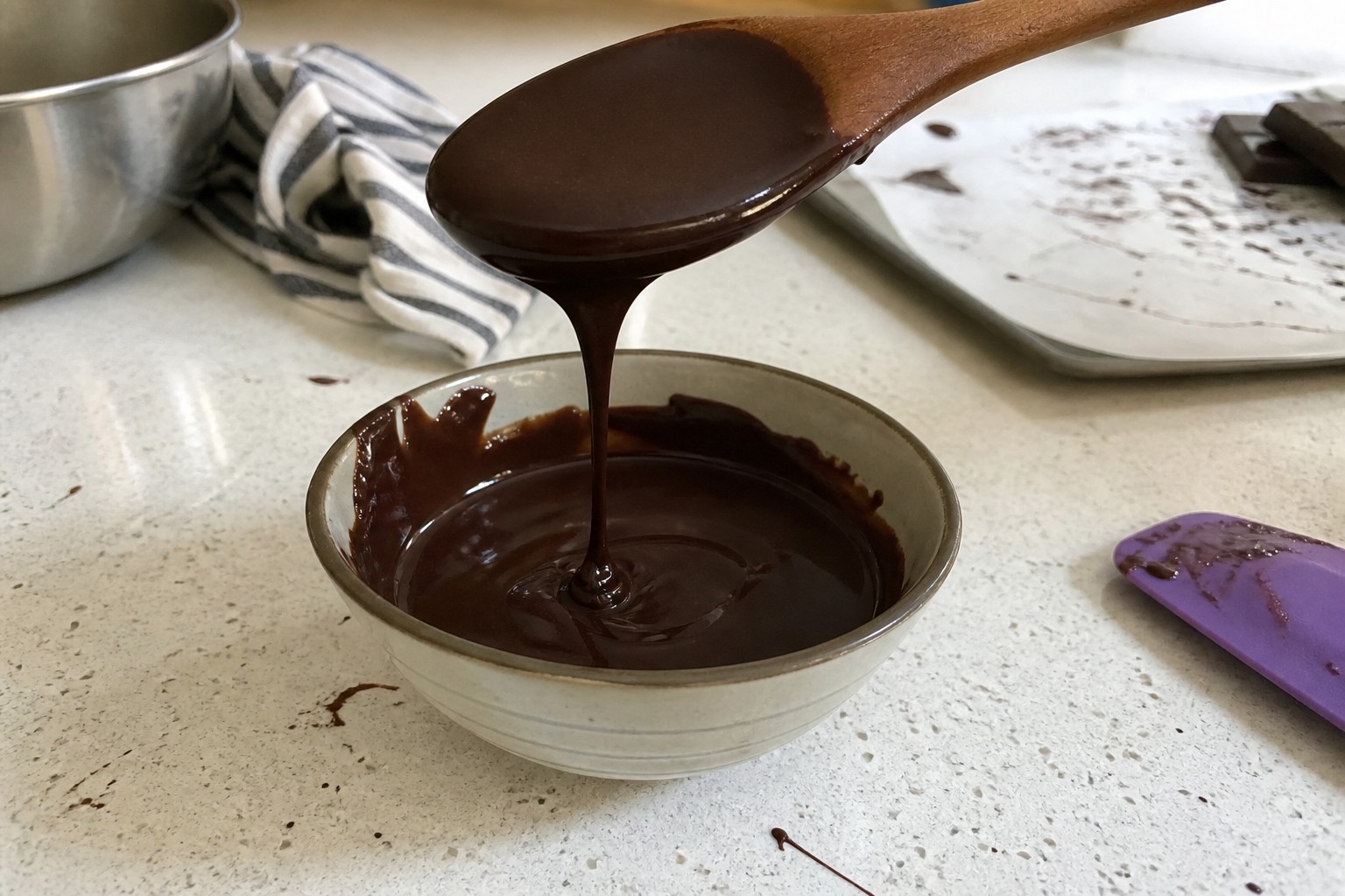 A practical a dark glaze that covers a Sacher cake cleanly step